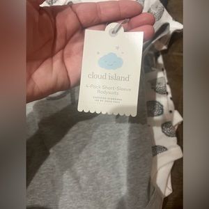 New with tags 4 pack of Cloud Island Baby Onesies